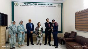 Mr. Manthar Ali Jatoi (Consultant) presenting Ajrak to Mr. Chandan Malhi